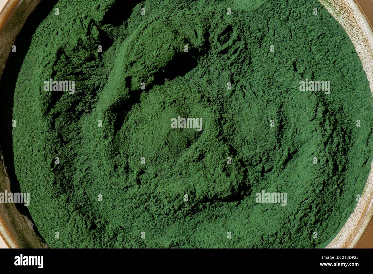 Organic bluegreen algae spirulina powder food in plate. Copy space for