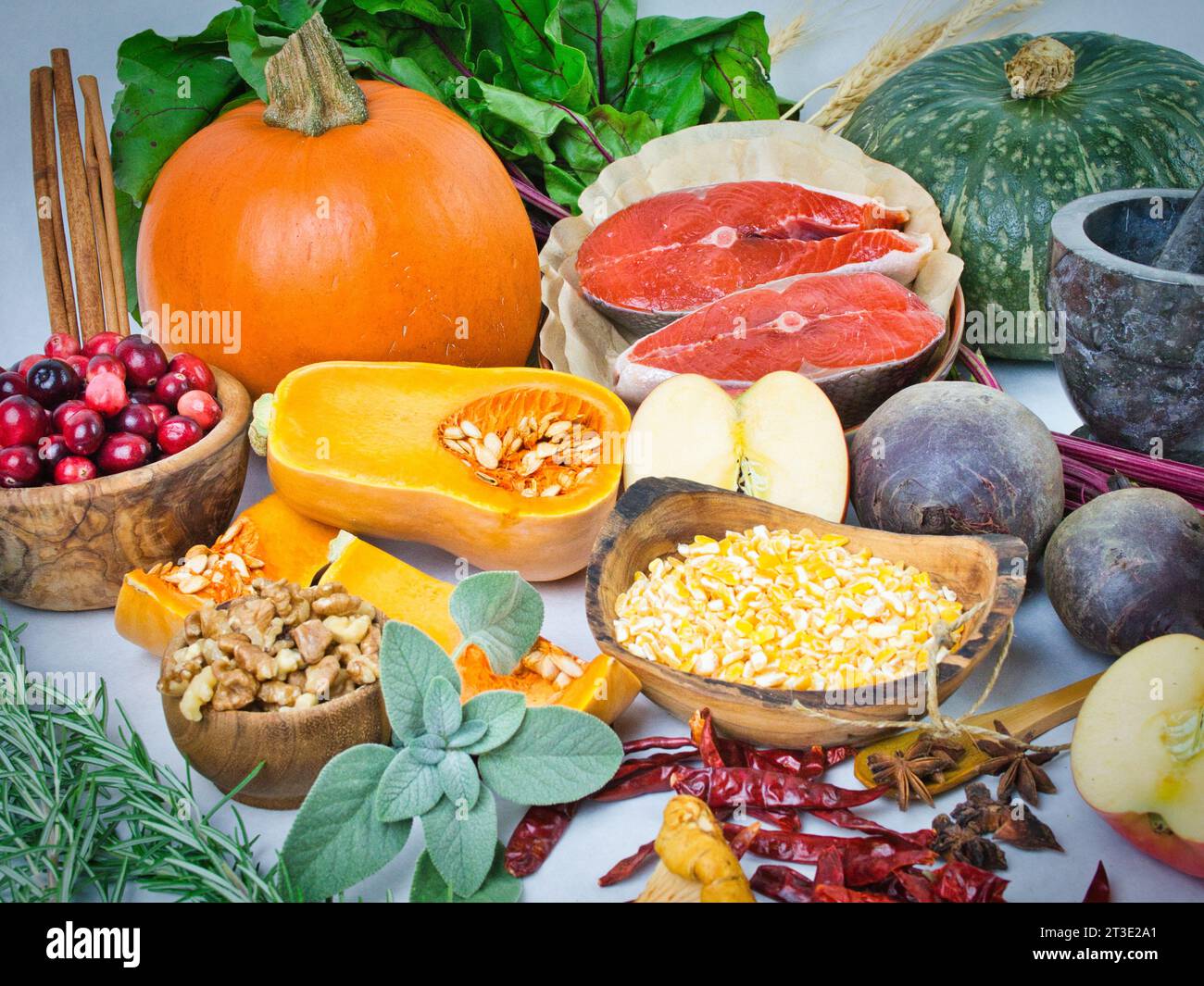 Colorful still life array of beautiful fall vegetable ingredients with ...