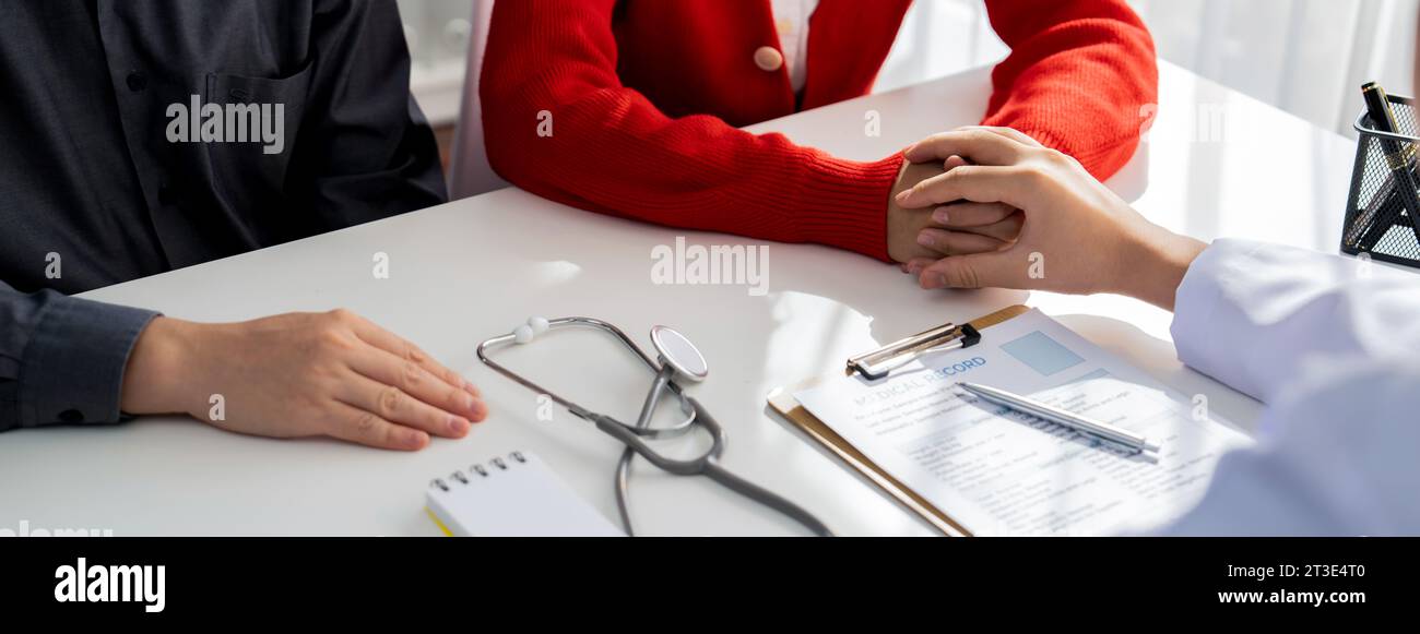 Couple attend fertility or medical consultation with gynecologist at hospital as family planning