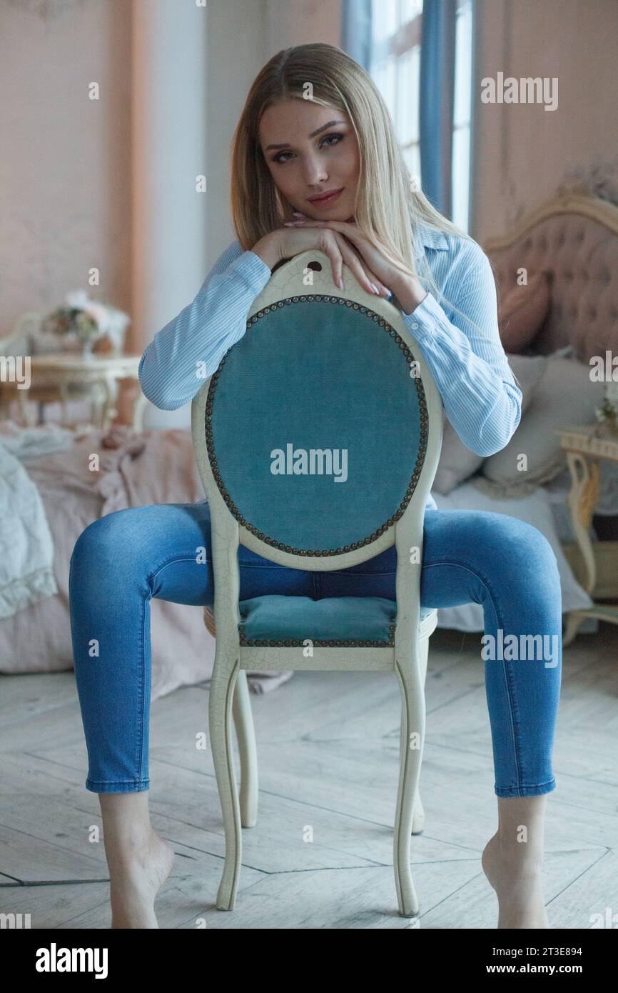 Beautiful blonde woman sitting hi-res stock photography and images - Alamy