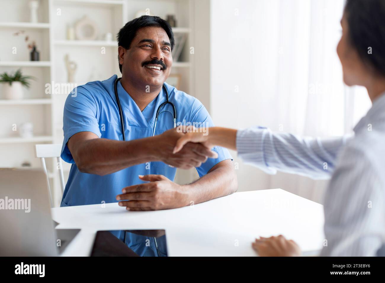 Indian doctor welcome patient hi-res stock photography and images - Alamy