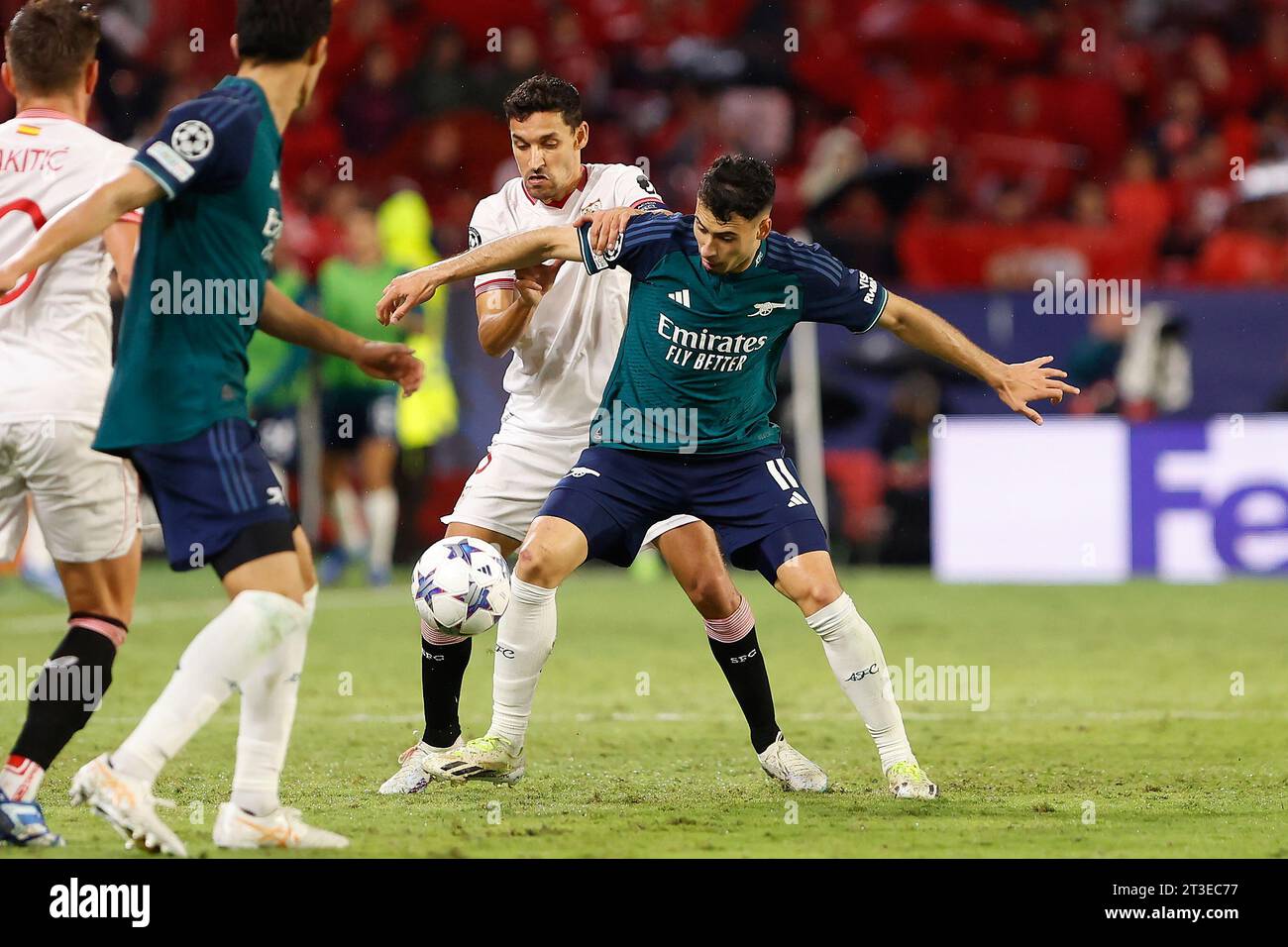 Seville, Spain. 24th Oct, 2023. Gabriel Martinelli (11) of Arsenal and Jesus Navas (16) of Sevilla FC seen during the UEFA Champions League match between Sevilla FC and Arsenal at Estadio Ramon Sanchez Pizjuan in Seville. (Photo Credit: Gonzales Photo/Alamy Live News Stock Photo