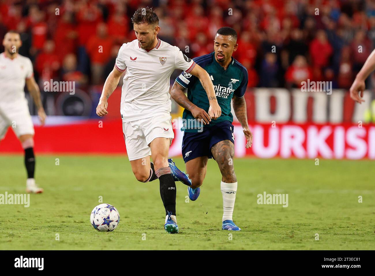 Seville, Spain. 24th Oct, 2023. Ivan Rakitic (10) of Sevilla FC and Gabriel Jesus (9) of Arsenal seen during the UEFA Champions League match between Sevilla FC and Arsenal at Estadio Ramon Sanchez Pizjuan in Seville. (Photo Credit: Gonzales Photo/Alamy Live News Stock Photo