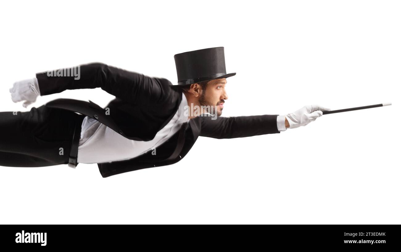 Magician levitating and holding a magic wand isolated on white background Stock Photo