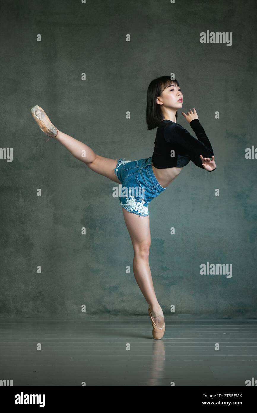 Petite Japanse ballerina in ballet pose Stock Photo