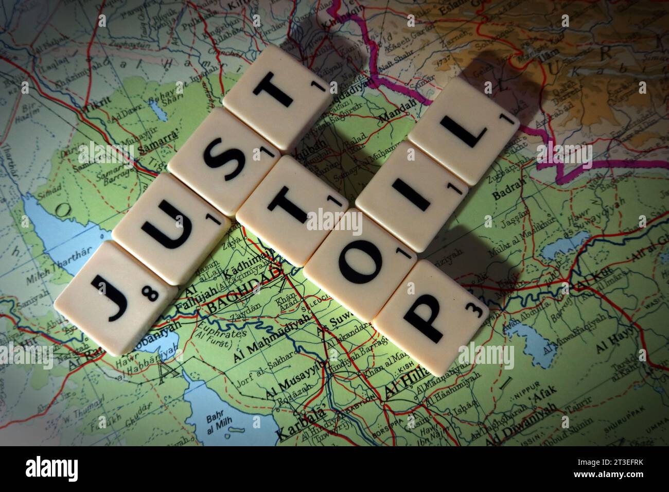 Just Stop Oil, in Scrabble letters, on a map of the Middle East Stock Photo