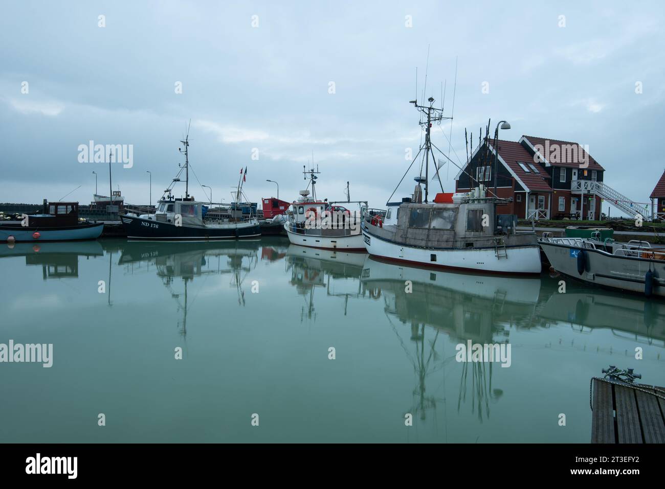 Fishing boats stand in the harbor of Klintholm Havn, Baltic Sea island of Mön, Denmark Stock Photo