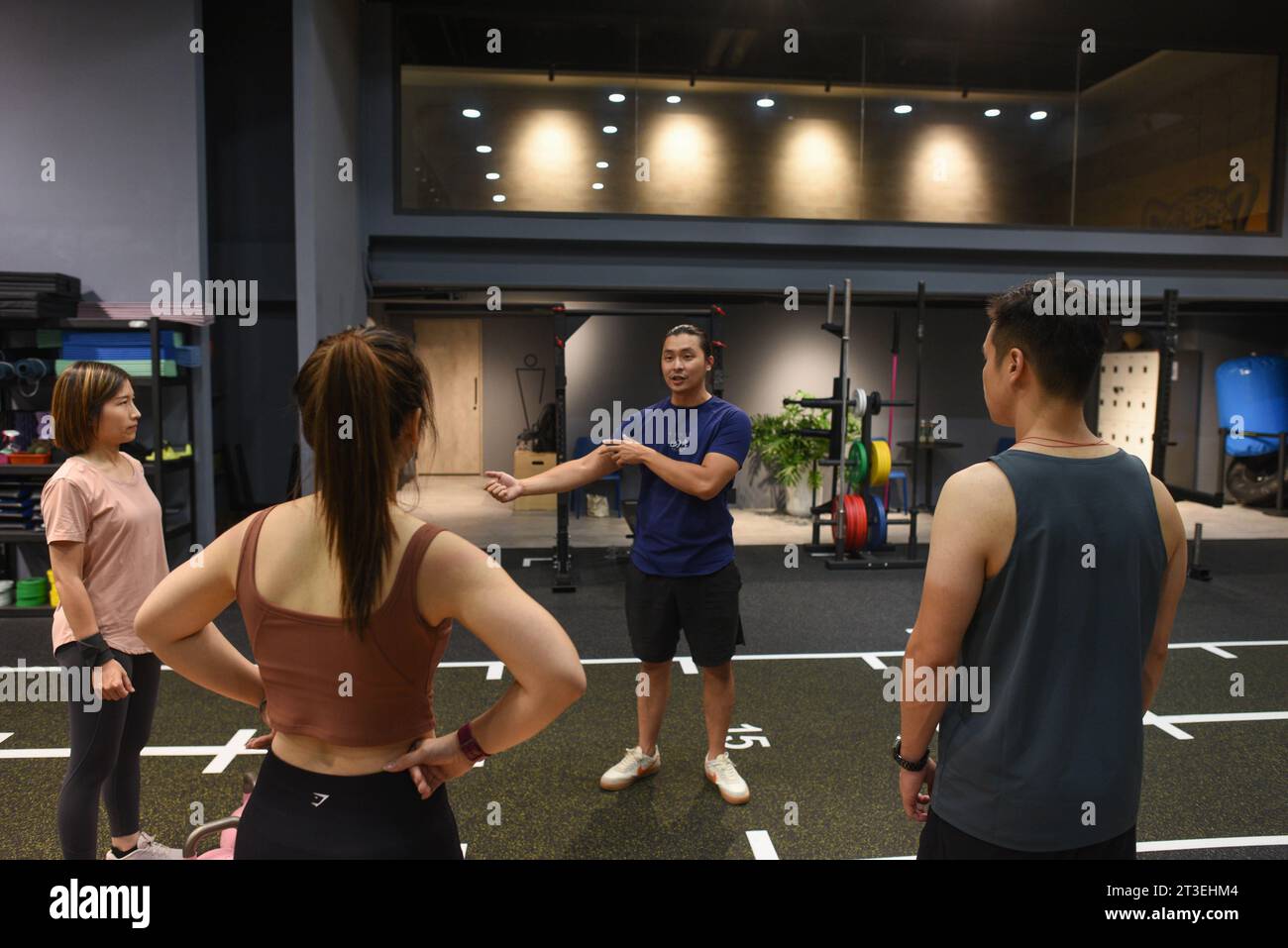 *** STRICTLY NO SALES TO FRENCH MEDIA OR PUBLISHERS - RIGHTS RESERVED ***October 04, 2023 - Taipei, Taiwan: Taiwanese civilians train in TH Schee's 4SC CrossFit gym. Schee draws from his experience in the Taiwanese Navy and as a volunteer during times of natural disaster to give lecture on how to prepare for civil defense. He opened a cross fit gym after realizing that the prerequisite was for Taiwanese civilians to get fitter. Stock Photo