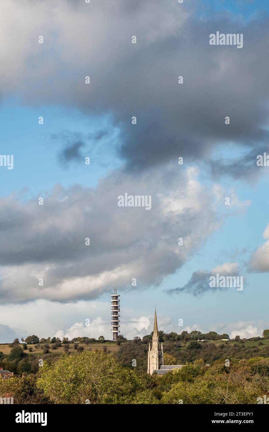 The Victorian spire of Holy Trinity church and the Purdown BT Tower (1970) seen from Thingwall Park allotments in Bristol, Somerset, UK Stock Photo