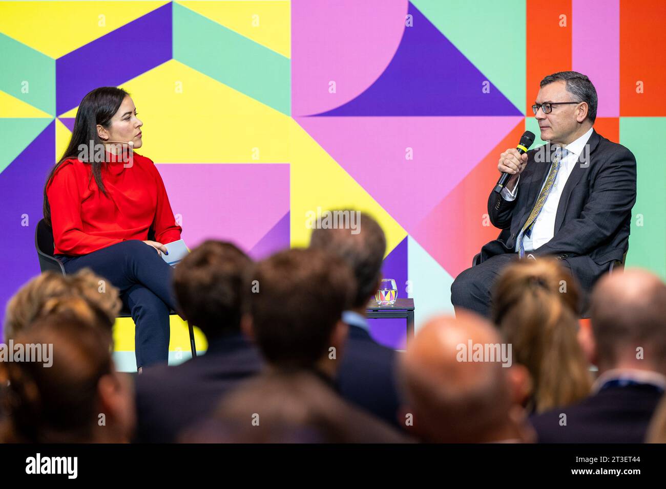 Munich, Germany. 25th Oct, 2023. Moderator Aline Abboud talks to Florian Herrmann, Head of the Bavarian State Chancellery and State Minister for Federal Affairs and Media, during the opening of the 37th Munich Media Days. One year after the revolutionary launch of the AI chatbot ChatGPT, the German media industry gathered in Munich to discuss artificial intelligence. The organizers expect a total of around 5,000 media professionals to attend the Medientage München - #MTM23 for short - which started on Wednesday. Credit: Lennart Preiss/dpa/Alamy Live News Stock Photo