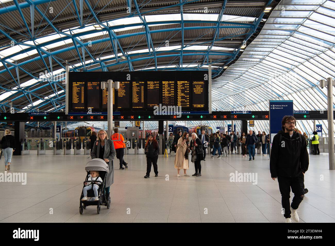 Waterloo, London, UK. 24th October, 2023. Passengers at Waterloo Railway Station in London. It has been announced that one day Travelcards are to continue. This comes as welcome news to rail passengers who would have been facing  higher costs to travel into London from the Home Counties if Sadiq Khan and TfL had scrapped the scheme. In other new, members of the RMT Union have voted in favour of another six months of industrial action. The treat of closing over 1,000 railway station ticket office still continues, however, the proposed plans have received much criticism of disability rights camp Stock Photo