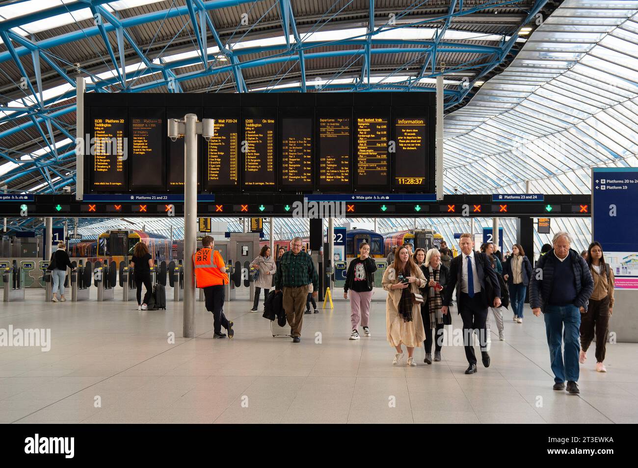 Waterloo, London, UK. 24th October, 2023. Passengers at Waterloo Railway Station in London. It has been announced that one day Travelcards are to continue. This comes as welcome news to rail passengers who would have been facing  higher costs to travel into London from the Home Counties if Sadiq Khan and TfL had scrapped the scheme. In other new, members of the RMT Union have voted in favour of another six months of industrial action. The treat of closing over 1,000 railway station ticket office still continues, however, the proposed plans have received much criticism of disability rights camp Stock Photo