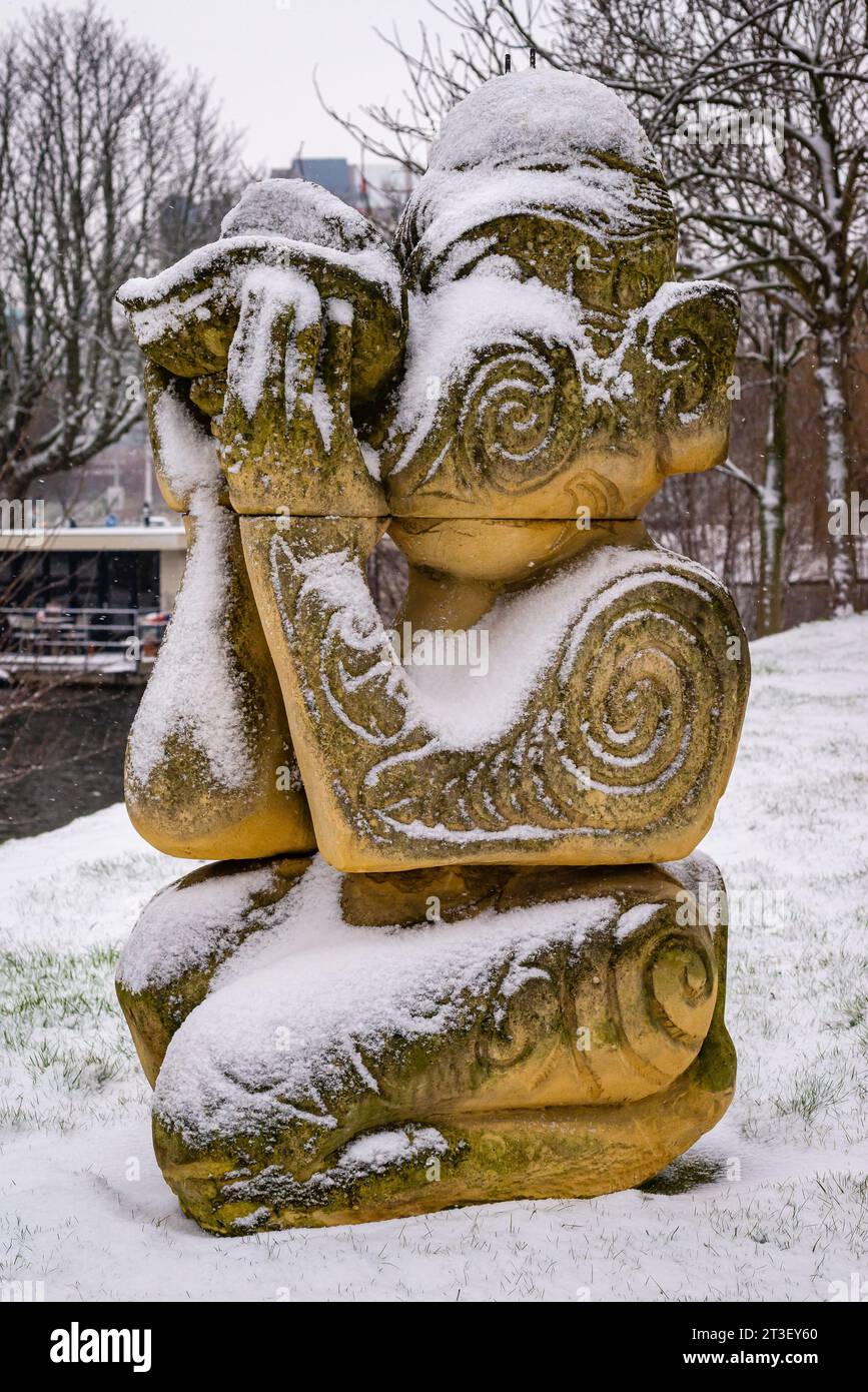 Stone sculpture as Maori under the snow in Leiden, Netherlands, cultural heritage Stock Photo