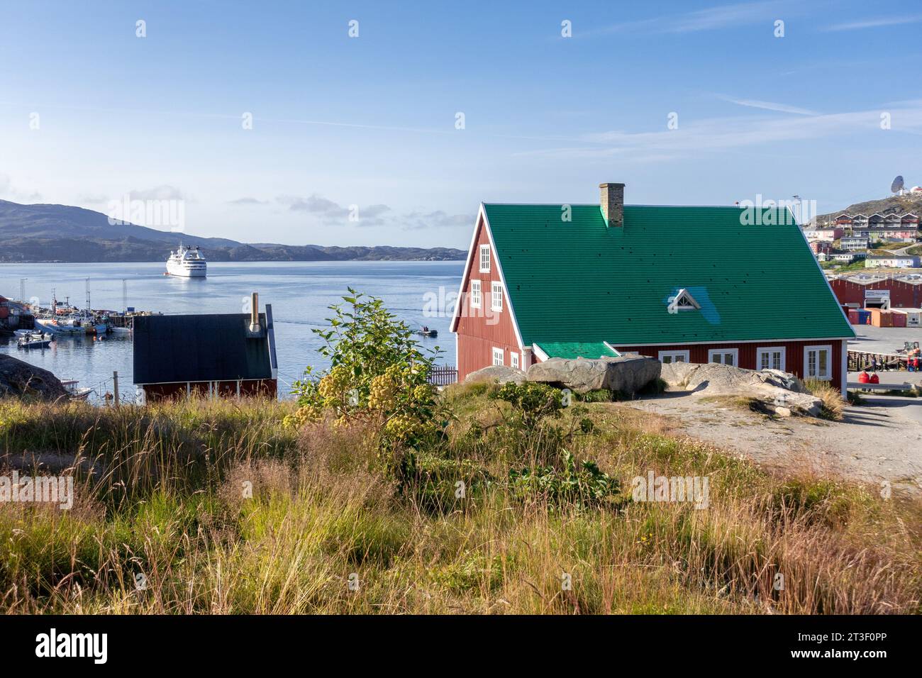 Traditional Greenland House In The Town Of Qaqortoq Greenland, Looking At The Port Area In The Early Morning Stock Photo