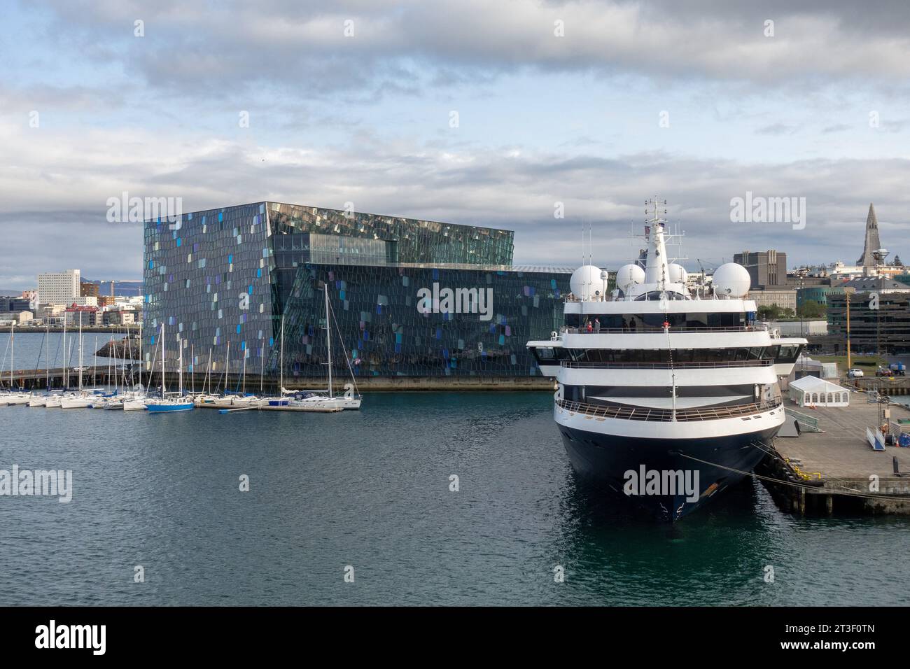 Atlas Ocean Voyages World Traveller Small Yacht-Style Cruise Ship In Midbakki Port Reykjavik Iceland Outside The Harpa Centre Stock Photo