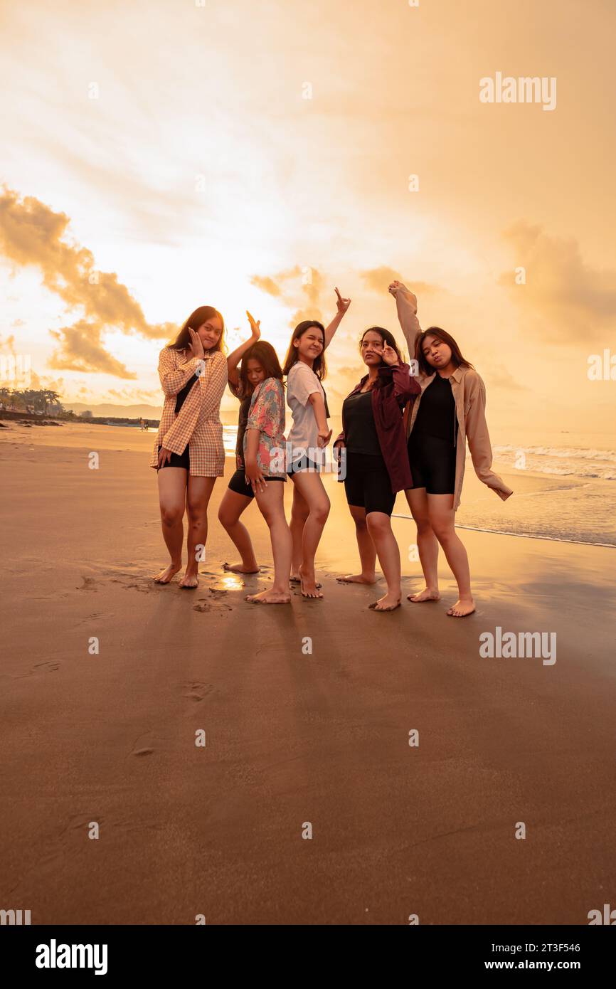 a-group-of-indonesian-women-enjoy-the-beach-happily-when-they-meet