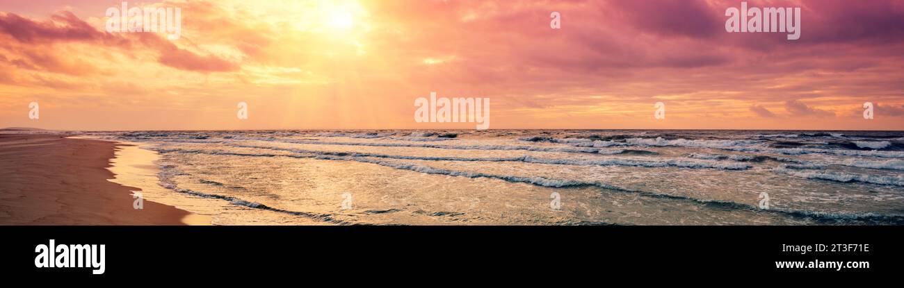 Purple sunrise over sea Stock Photo - Alamy