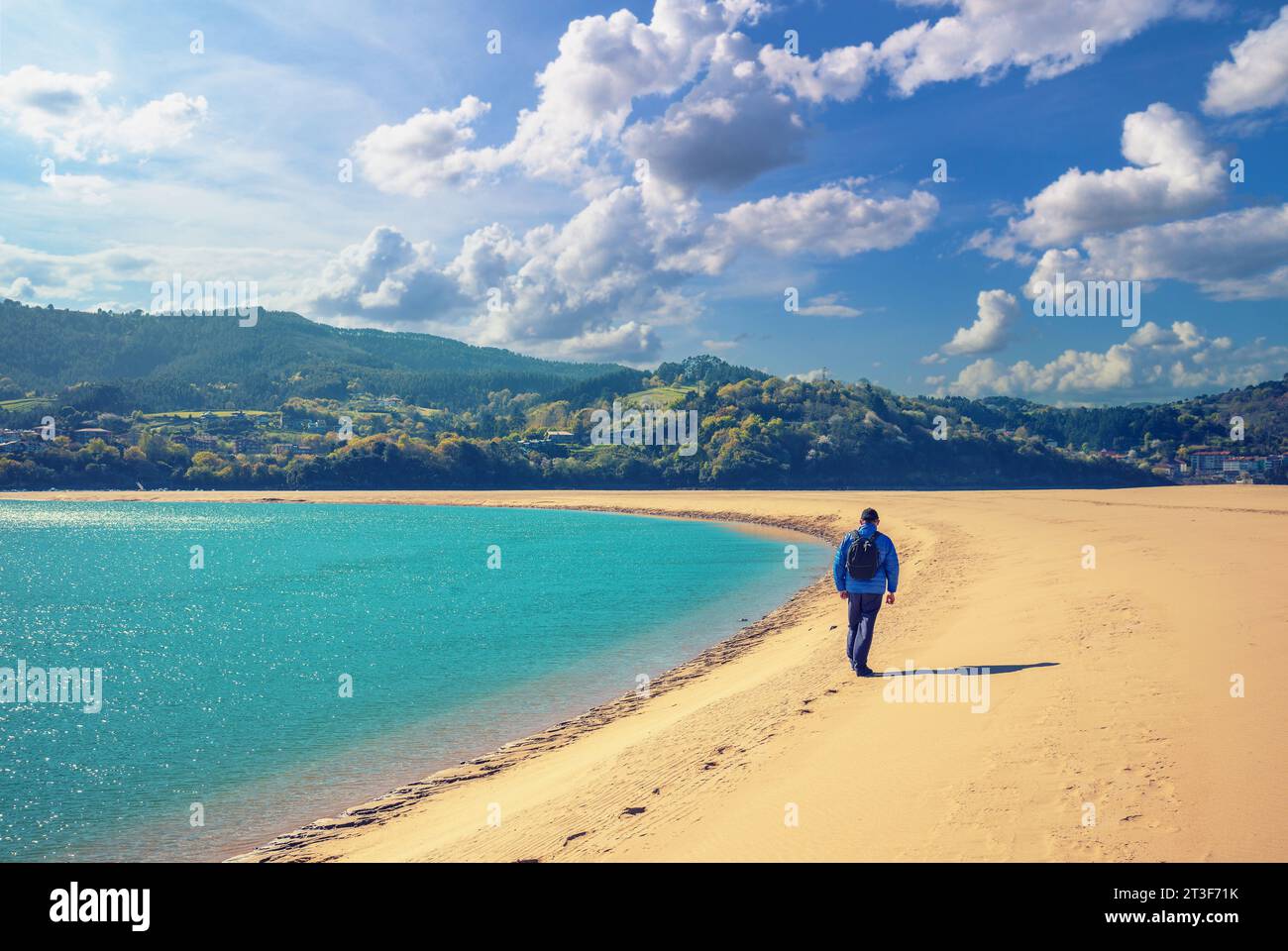 A man walks on the beach. Man looks at the sea Stock Photo