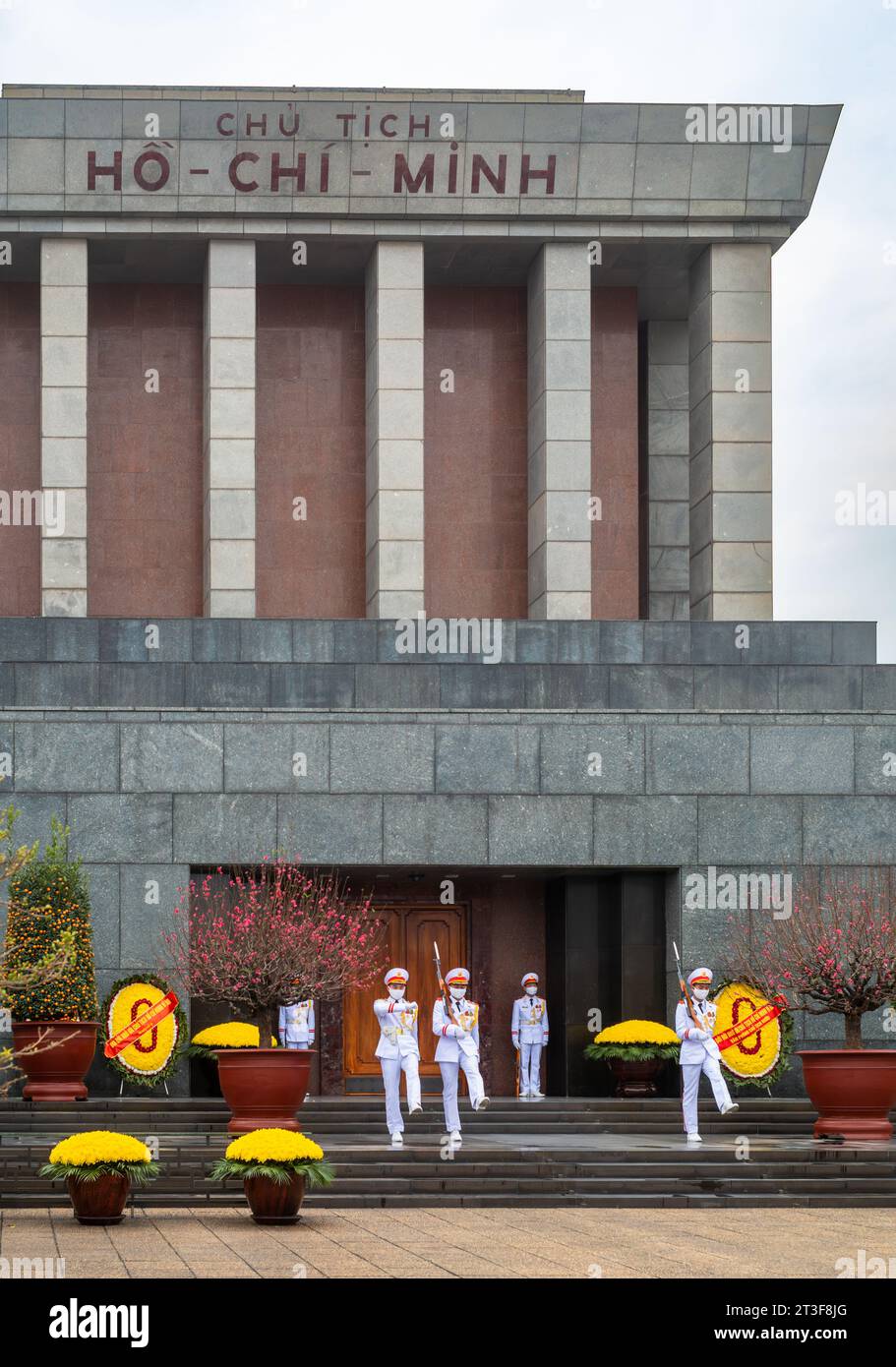 White-uniformed soldiers march and goose step at the Changing of the Guard at the Ho Chi Minh Mausoleum, Hanoi, Vietnam. Stock Photo