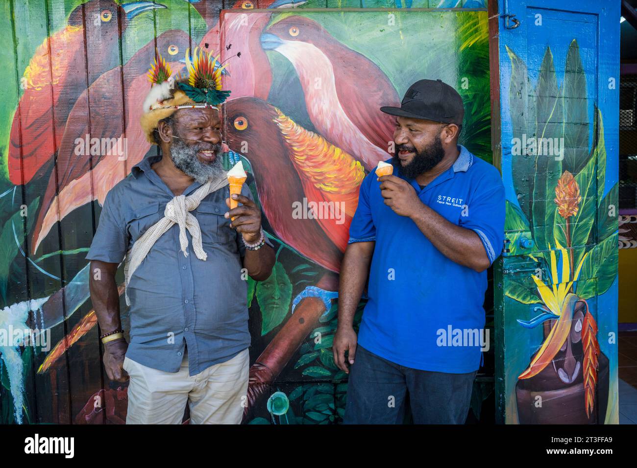 Papua New Guinea, Sepik province, chef Mundiya Kepanga eating an ice cream vanilla specialist Nanda Siri during a vanilla cultivation training in agroforestry as part of the STREIT project funded by the European Union Stock Photo