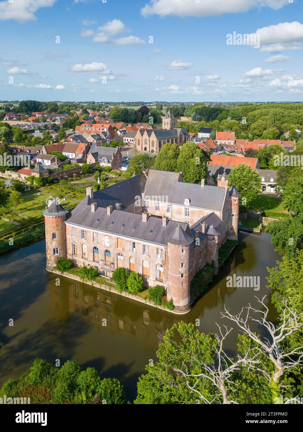 France, Nord, Esquelbecq, favorite village of the French 2023, castle of Esquelbecq and Saint Folquin church (aerial view) Stock Photo