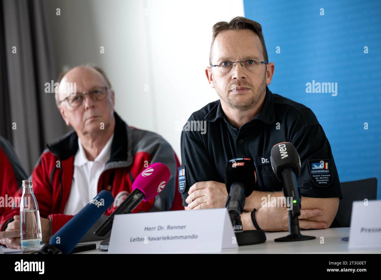 Cuxhaven, Germany. 25th Oct, 2023. Michael Ippich (l) of the German Maritime Search and Rescue Service, Robby Renner (r), head of the German Maritime Casualty Command, at a press conference. After the collision of two cargo ships in the North Sea southwest of Helgoland, the average command assumes the death of the four missing sailors. Credit: Sina Schuldt/dpa/Alamy Live News Stock Photo