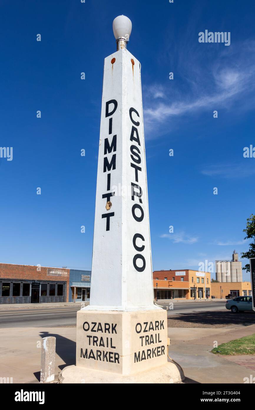 Tall white obelisk, a marker for the Ozark Trail, an early highway system established in 1913, built by local municipalities to connect communities. Stock Photo
