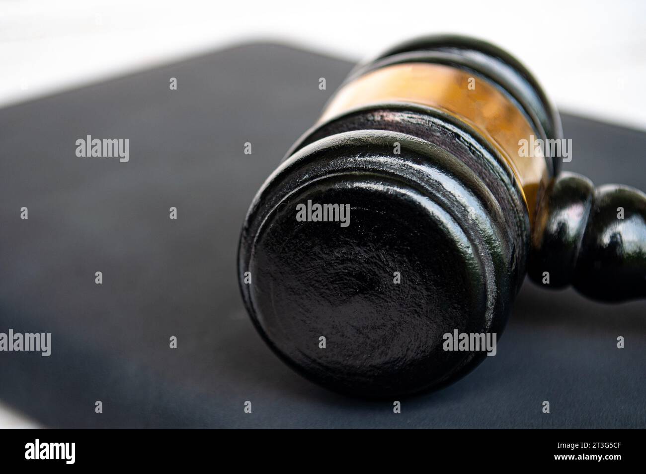 Close up of gavel on black book. Copy space and law concept. Stock Photo