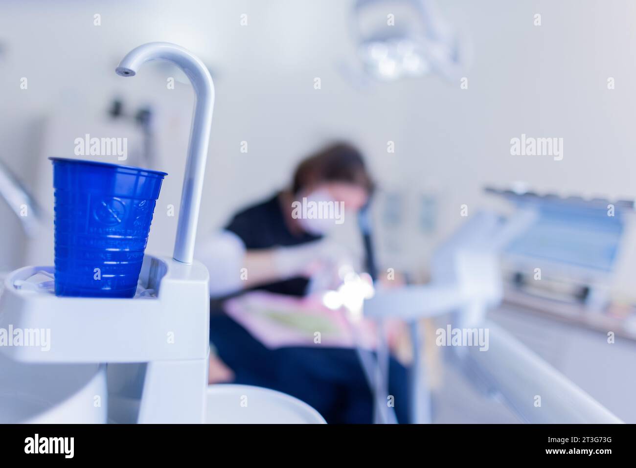 23 October 2023, North RhineWestphalia, Mönchengladbach A dental assistant is cleaning a
