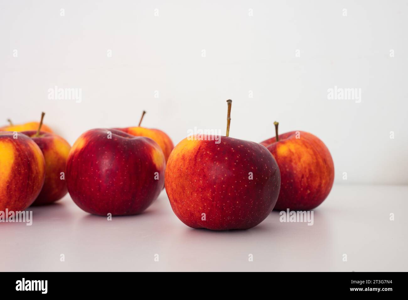 Group of yellow red apples. Organic fresh fruits and image of autumn harvest Stock Photo