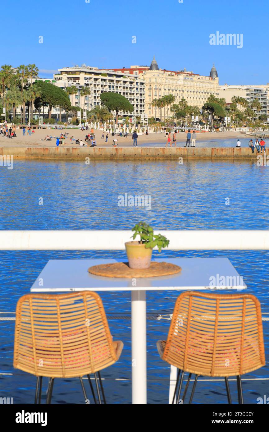 France, Alpes Maritimes, Cannes, Croisette, La Plage Le Majestic, B Fire restaurant (Barriere group) with a menu created by chef Mauro Colagreco and in the background the Carlton Hotel Stock Photo