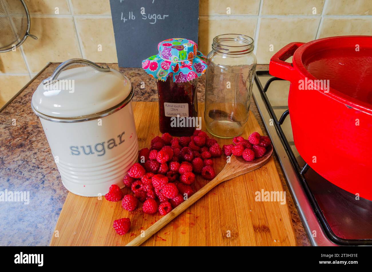 Jam making equipment including fresh raspberries and preserving pan Stock Photo Alamy
