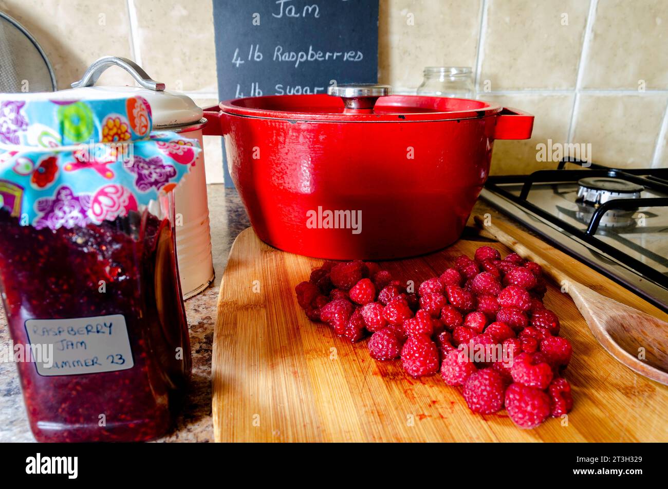 Jam making equipment including fresh raspberries and preserving pan Stock Photo Alamy
