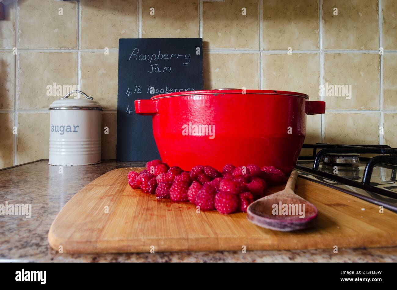 Jam making equipment including fresh raspberries and preserving pan
