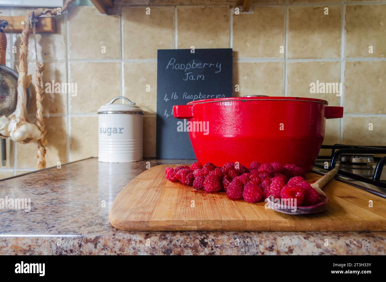 Jam making equipment including fresh raspberries and preserving pan Stock Photo Alamy