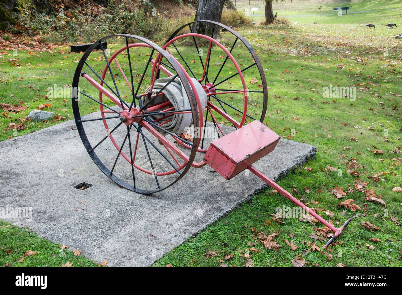 Vintage fire hose reel at Fort Rodd Hill & Fisgard Lighthouse National Historic Site in Victoria, British Columbia, Canada Stock Photo