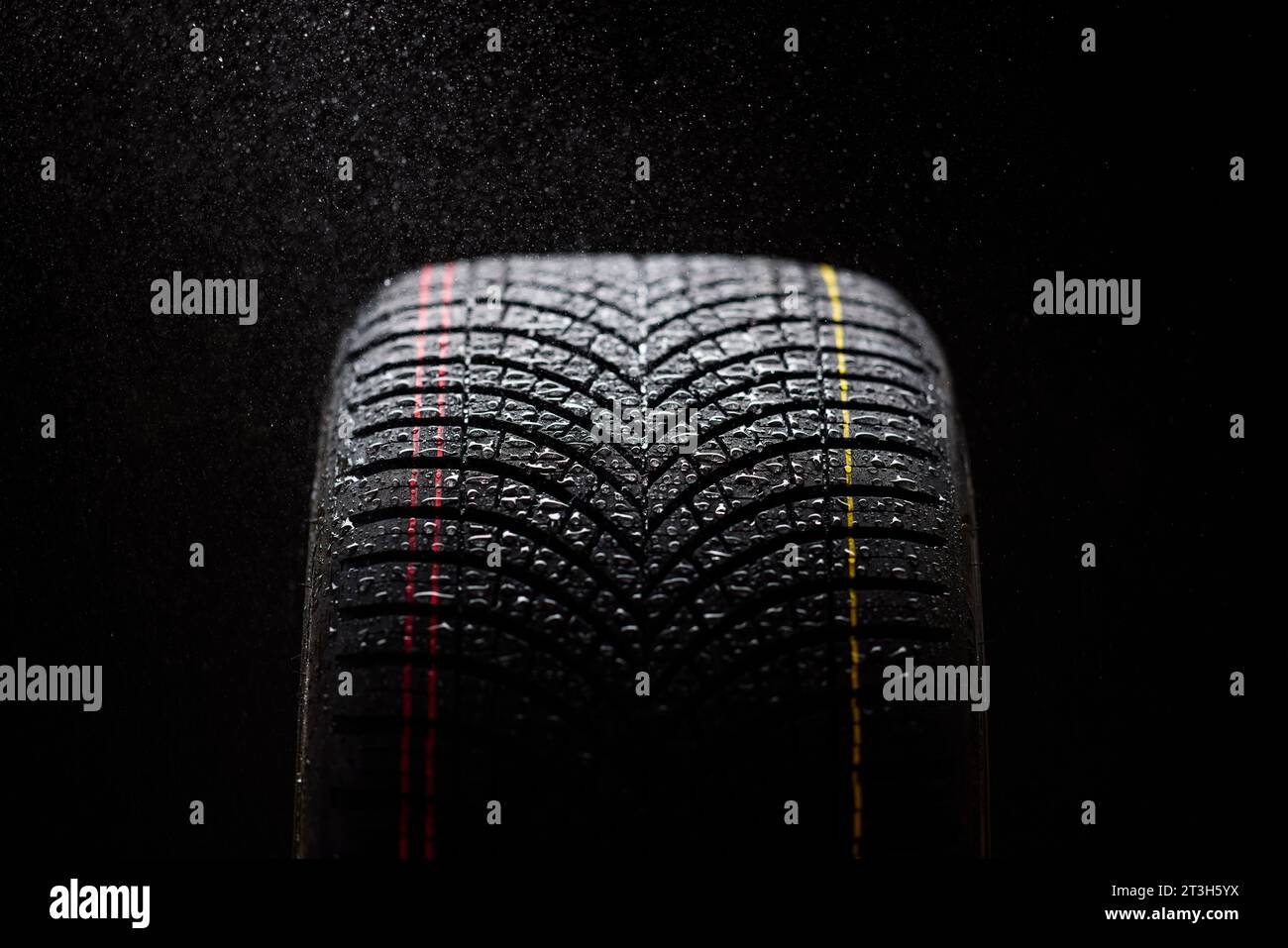 Close up of wet winter tyres Stock Photo