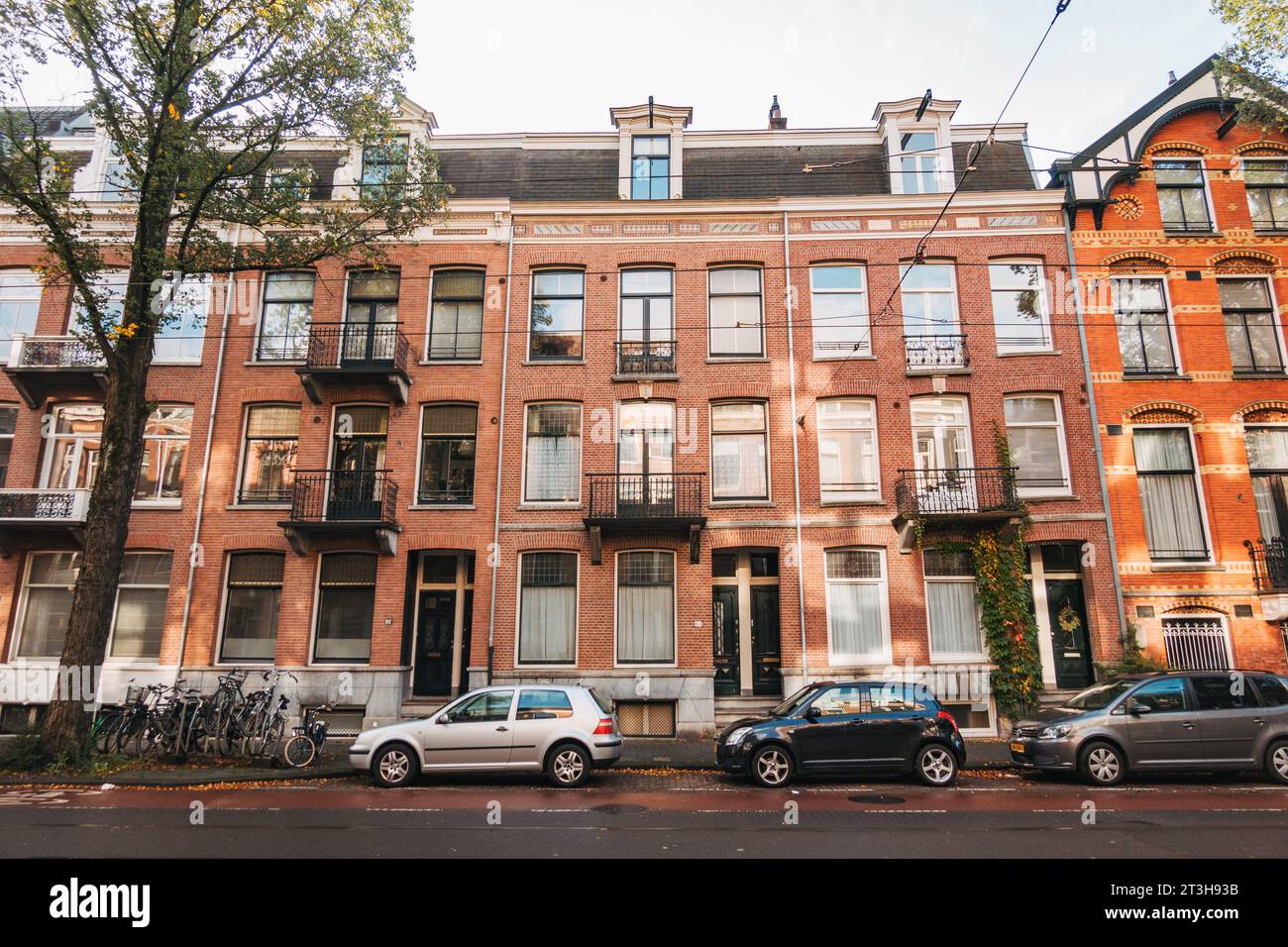 brick apartment buildings line Willemsparkweg, a residential street in