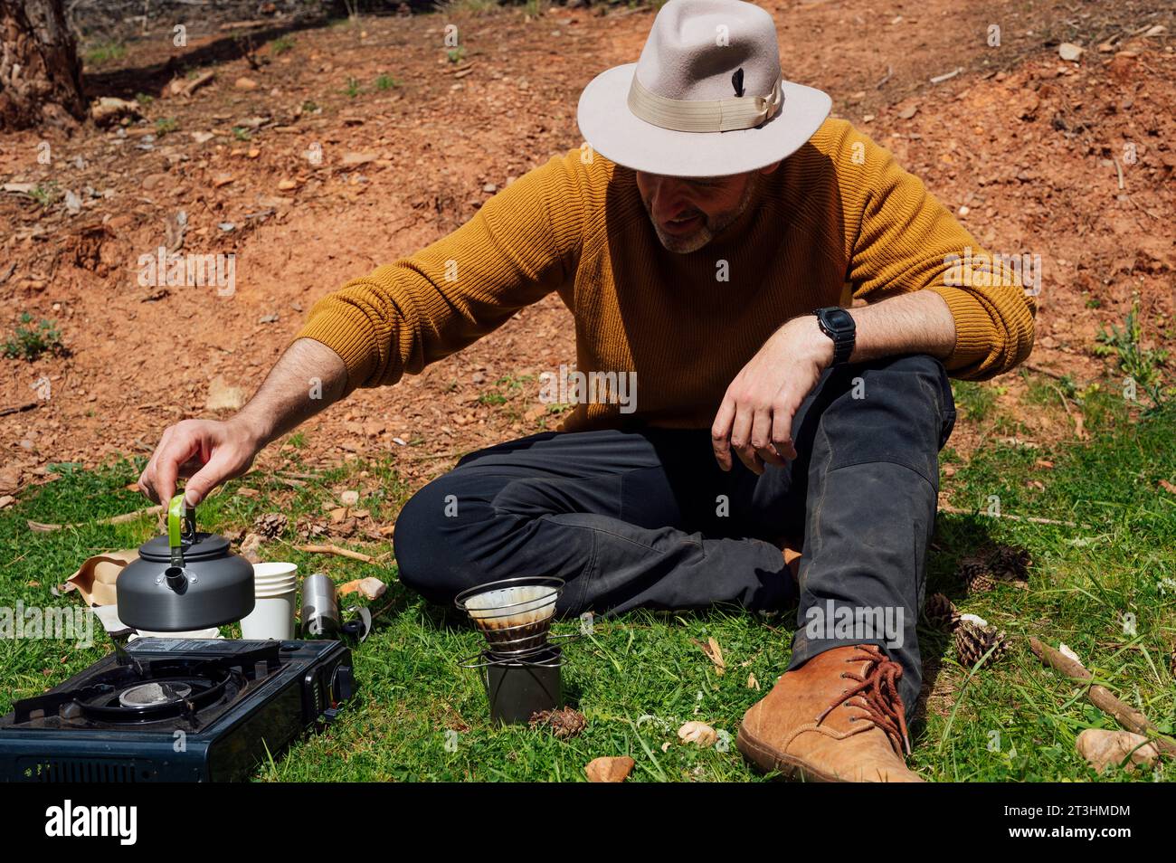 Process of making camping coffee outdoor with metal geyser coffee maker on  a gas burner, step by step. Travel activity for relaxing, bushcraft, advent  Stock Photo - Alamy