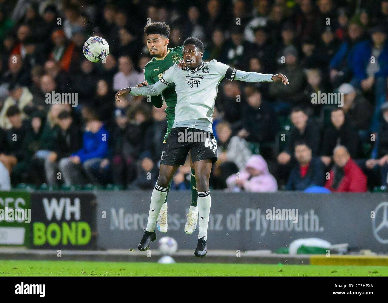 Kaine Kesler Hayden 29 of Plymouth Argyle battles in the air during