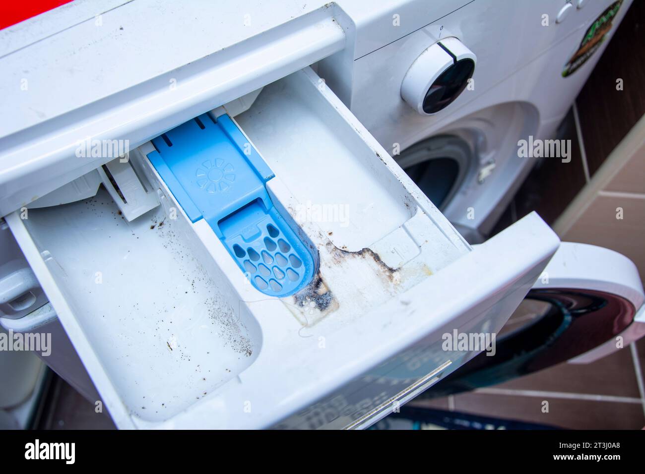 Dirty and moldy detergent drawer of the washing machine Stock Photo Alamy