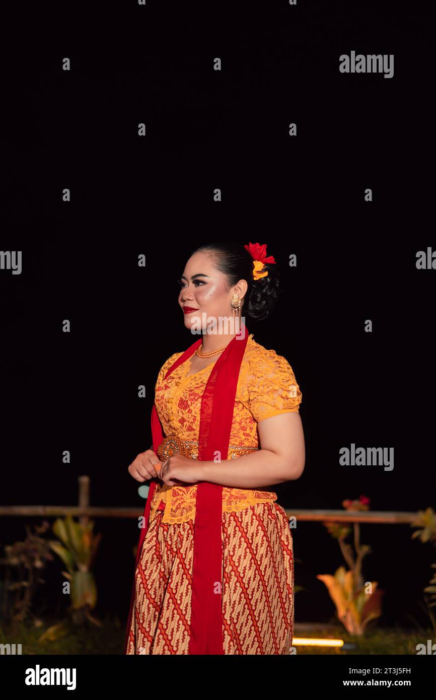 gorgeous Balinese woman showing and performing traditional dress from