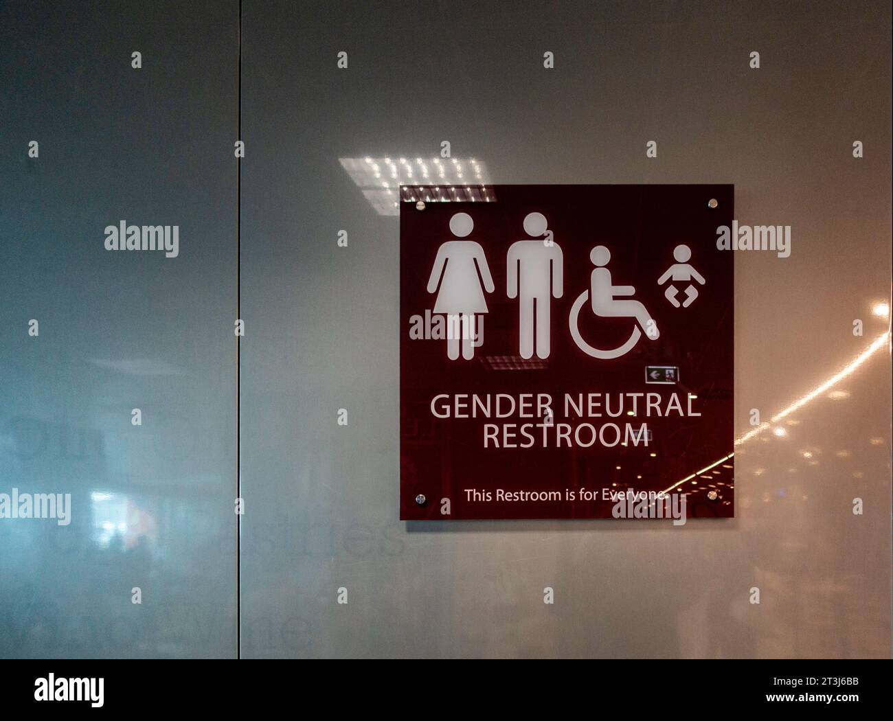 A sign for a gender neutral restroom in Brendisi Airport, Italy. Stock Photo