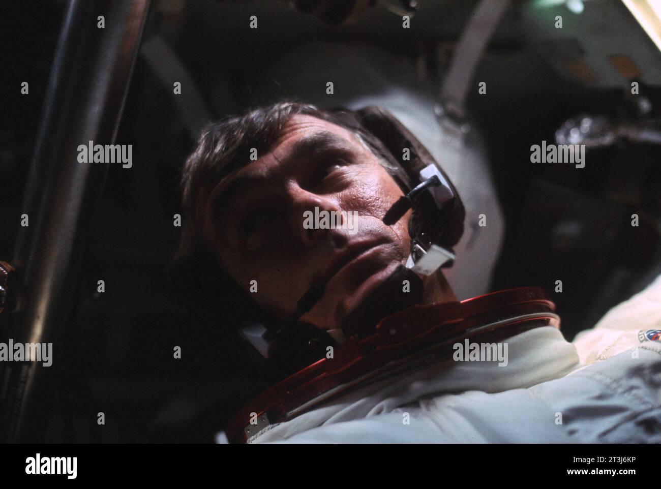 Eugene A. Cernan inside the Apollo 17 Command Module  Astronaut Eugene A. Cernan appears in this candid photograph taken by a fellow crewman aboard the Apollo 17 spacecraft near the end of their first day in space. Also, aboard Apollo 17 were astronaut Ronald E. Evans, command module pilot, and scientist-astronaut Harrison H. 'Jack' Schmitt, lunar module pilot. Cernan was the mission commander.   Image Number: AS17-162-24035 Date: December 7, 1972 Stock Photo