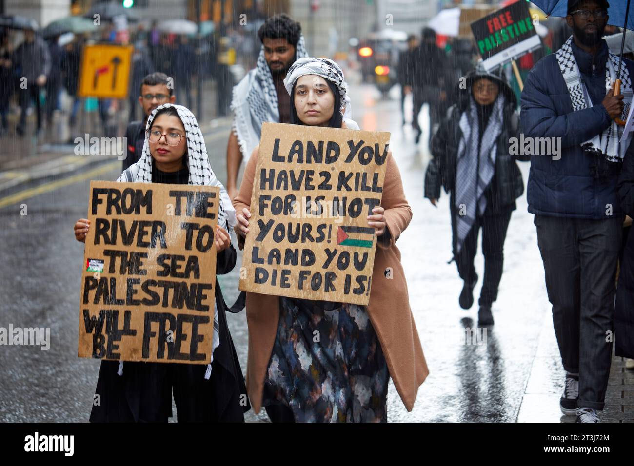 London, U.K. - 21 Oct 2023.: Protestors holding placards during a National March for Palestine, organised by the Palestine Solidarity Campaign. Stock Photo