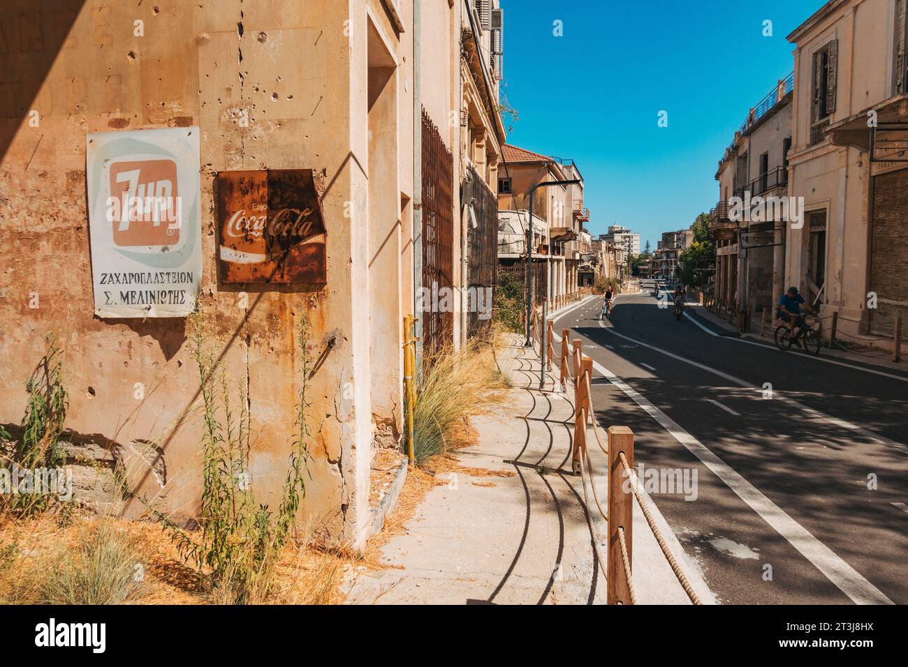 old 7-Up and Coca-Cola signs in the town of Varosha, Northern Cyprus. Abandoned in 1974 after Turkish troops invaded. Opened to tourists in 2020 Stock Photo