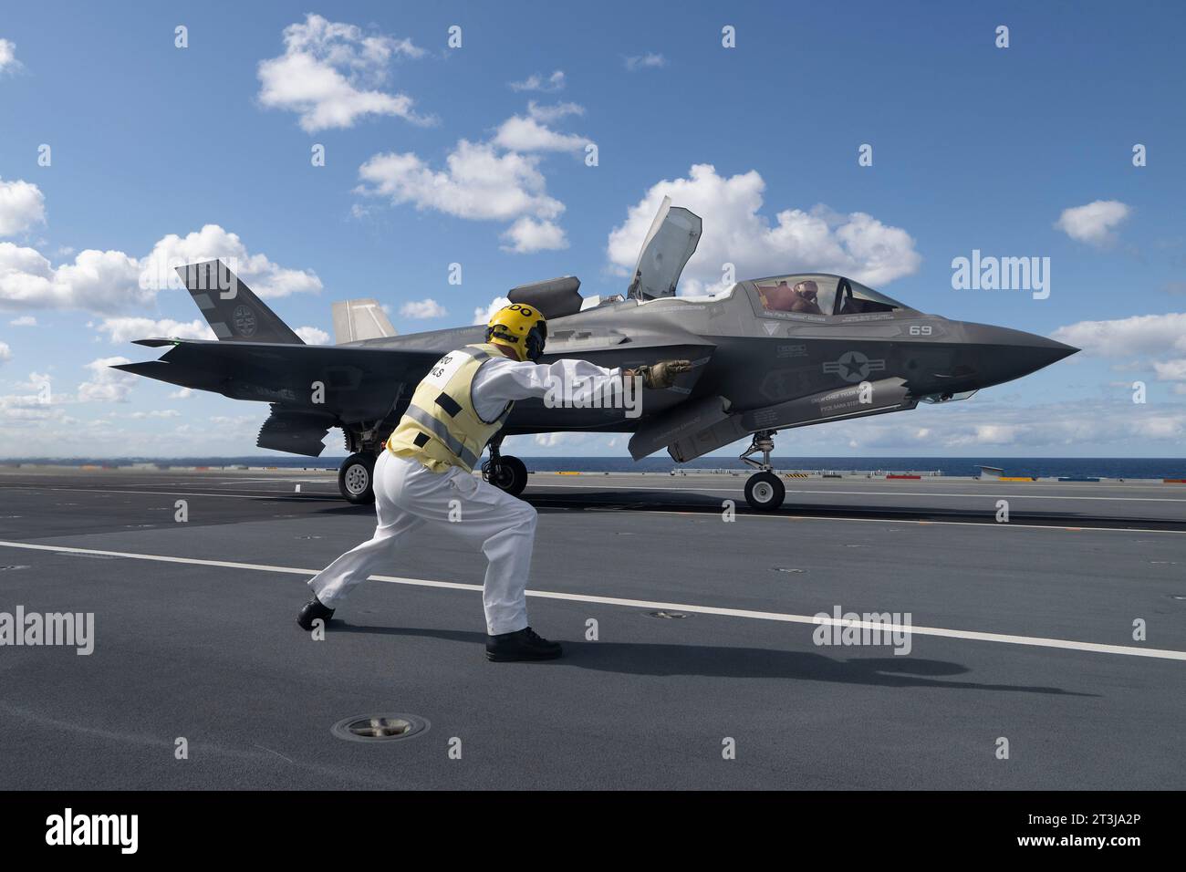Patuxent River, United States. 24th Oct, 2023. A Royal Navy aircraft handler directs a U.S Marine Corps F-35B Lightning II stealth fighter aircraft to launch from the flight deck of the Royal Navy Queen Elizabeth-class aircraft carrier HMS Prince of Wales during developmental test phase 3 flight trials, October 24, 2023 off the coast of Maryland, USA. Credit: Michael Jackson/U.S. Navy Photo/Alamy Live News Stock Photo