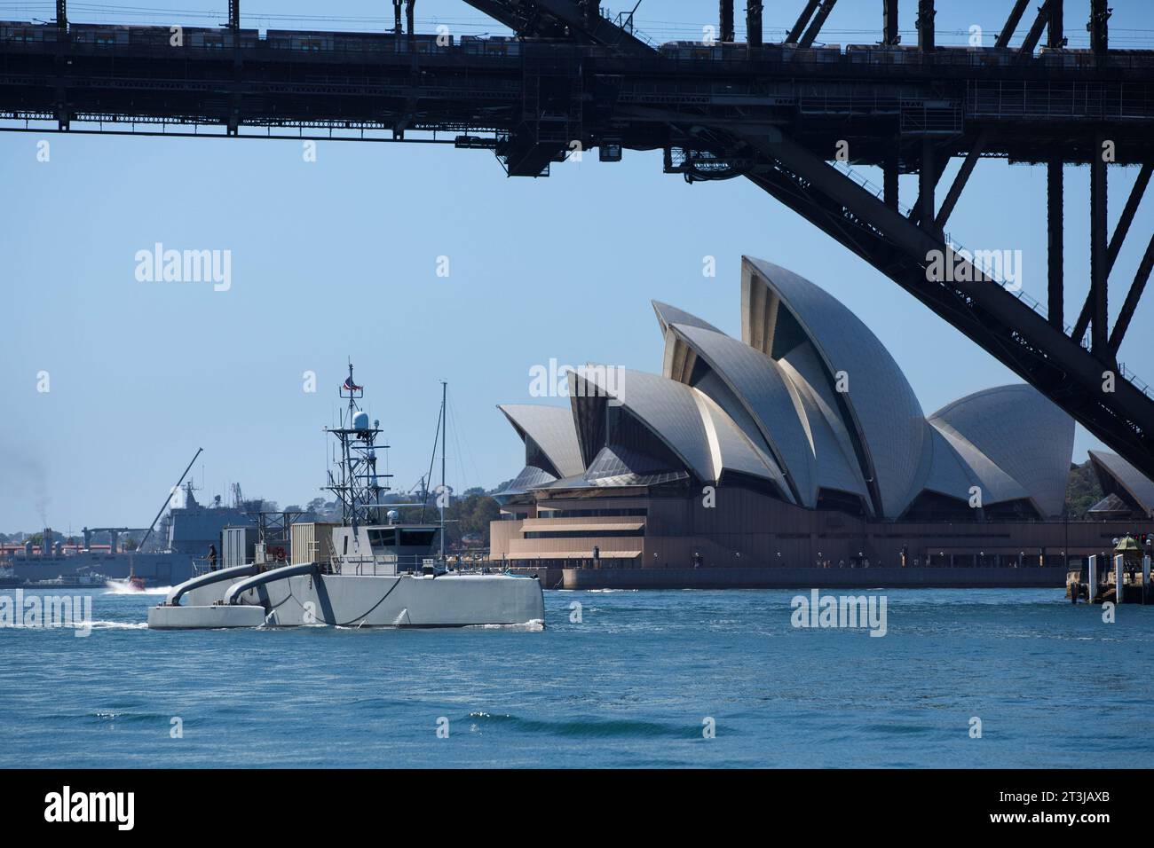 Sydney, Australia. 24th Oct, 2023. The U.S Navy unmanned surface vessel USV Seahawk transits underneath the Sydney Harbor bridge as it passes the Sydney Opera House during a scheduled port visit, October 24, 2023 in Sydney, NSW, Australia. Credit: ESN Pierson Hawkins/US Army/Alamy Live News Stock Photo