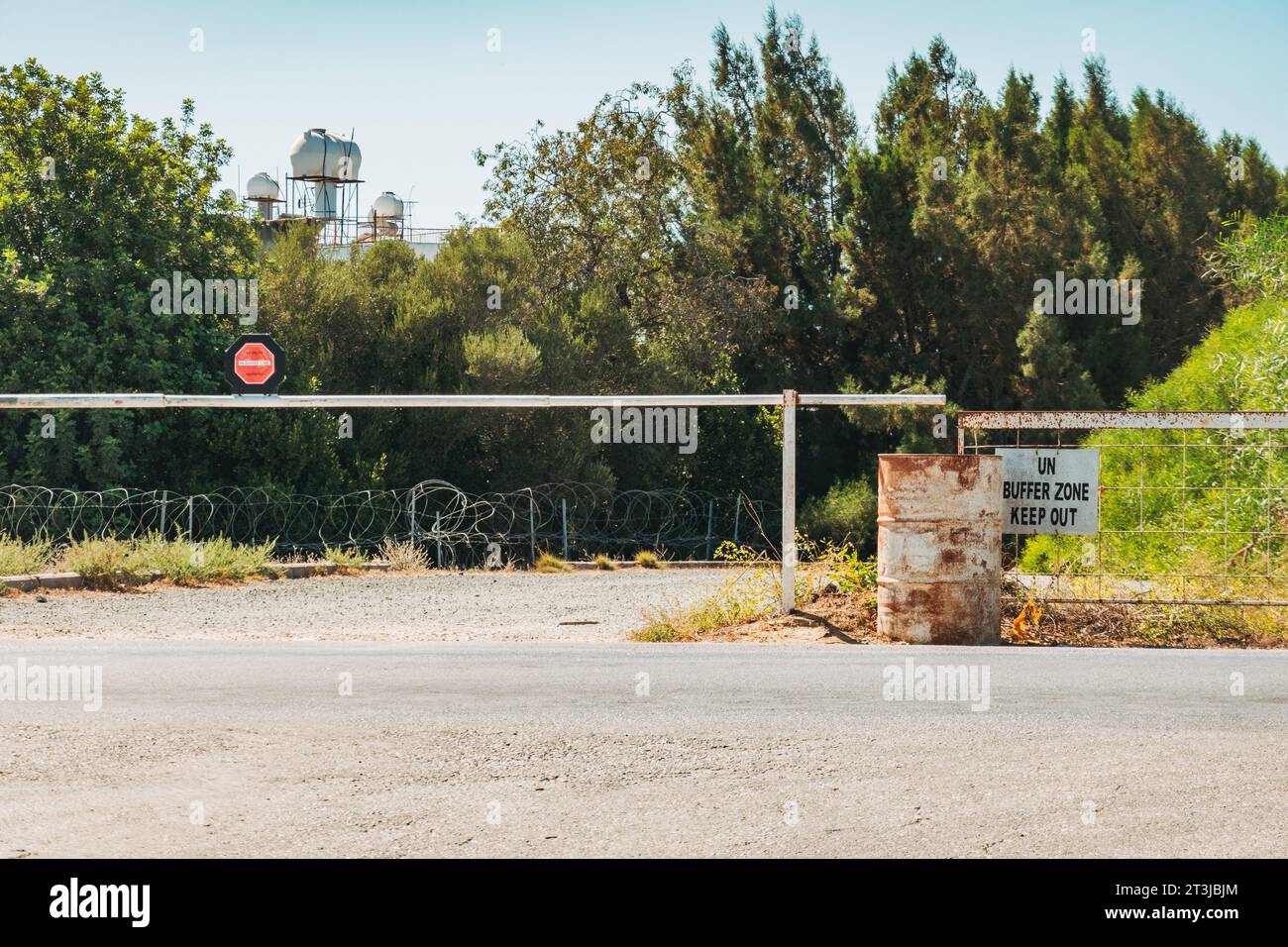 a sign reads 'UN Buffer Zone, Keep Out' at a border crossing between the northern and southern regions of the island of Cyprus Stock Photo
