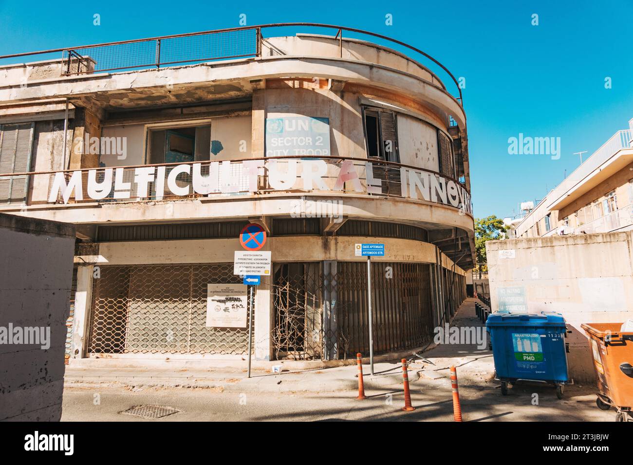 an abandoned corner store in south Nicosia. A UN Sector 2 City Troop sign is visible on the top storey Stock Photo